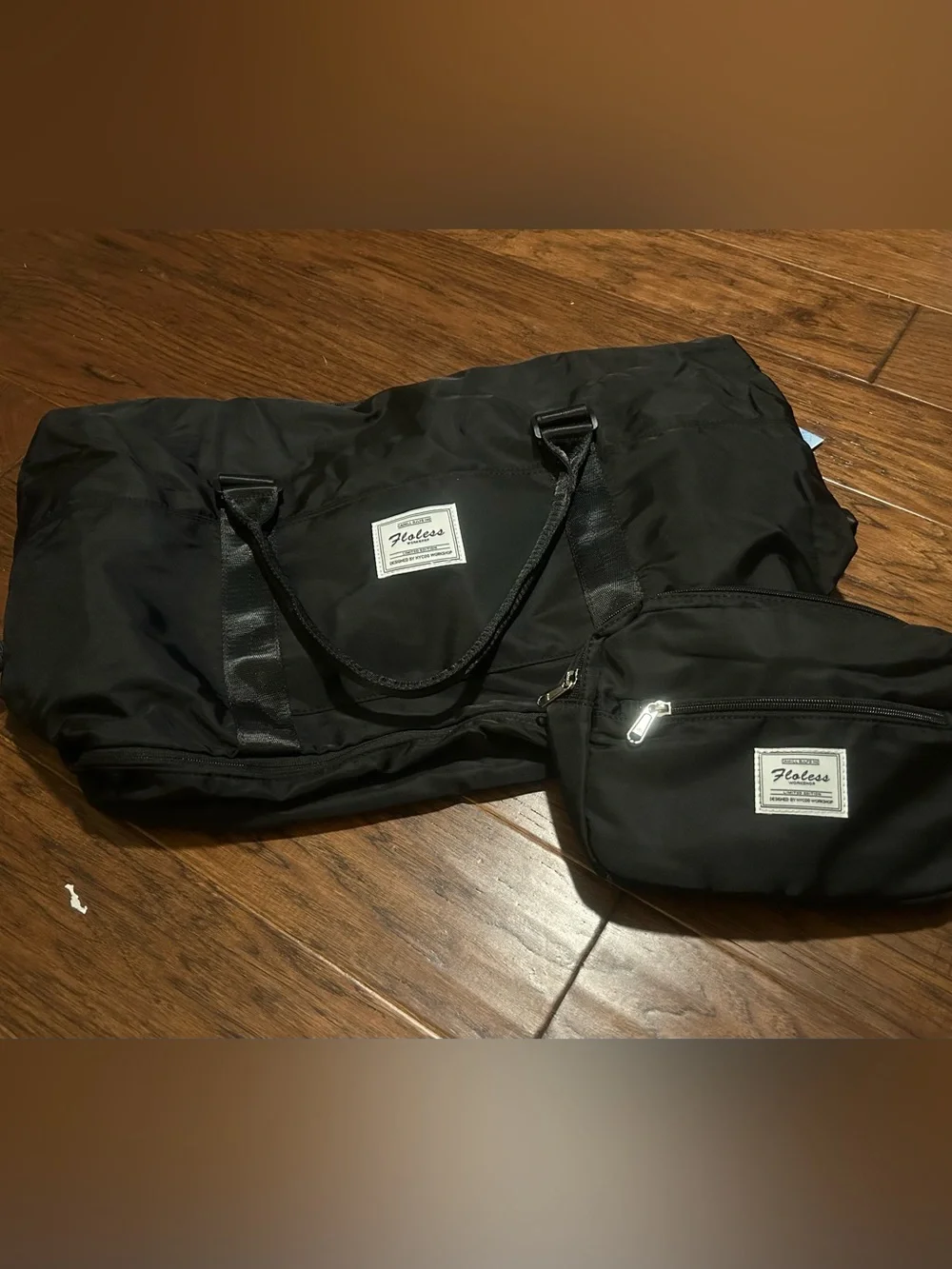 black Floless Workshop limited edition duffel bag with toiletry bag